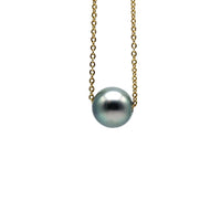 Close up, studio photo of a gold filled Floating Pearl necklace featuring an 8mm rare blue colored pearl.
