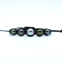Pearl bracelet with five pearls on a white background