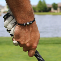 Takaroa Bracelet worn on the golf course — durable, waterproof Tahitian pearl bracelet for everyday wear