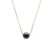 Necklace with a black pearl on a white background
