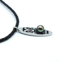 Necklace with a black cord and silver pendant featuring a pearl on a white background