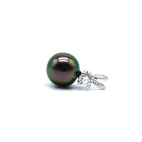 White gold with a lab grown diamond pendant featuring a black pearl on a white background