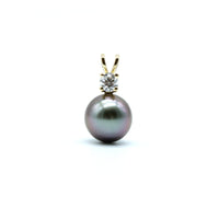 A single pearl pendant with a gold bail and a small clear stone accent, centered on a plain white background.