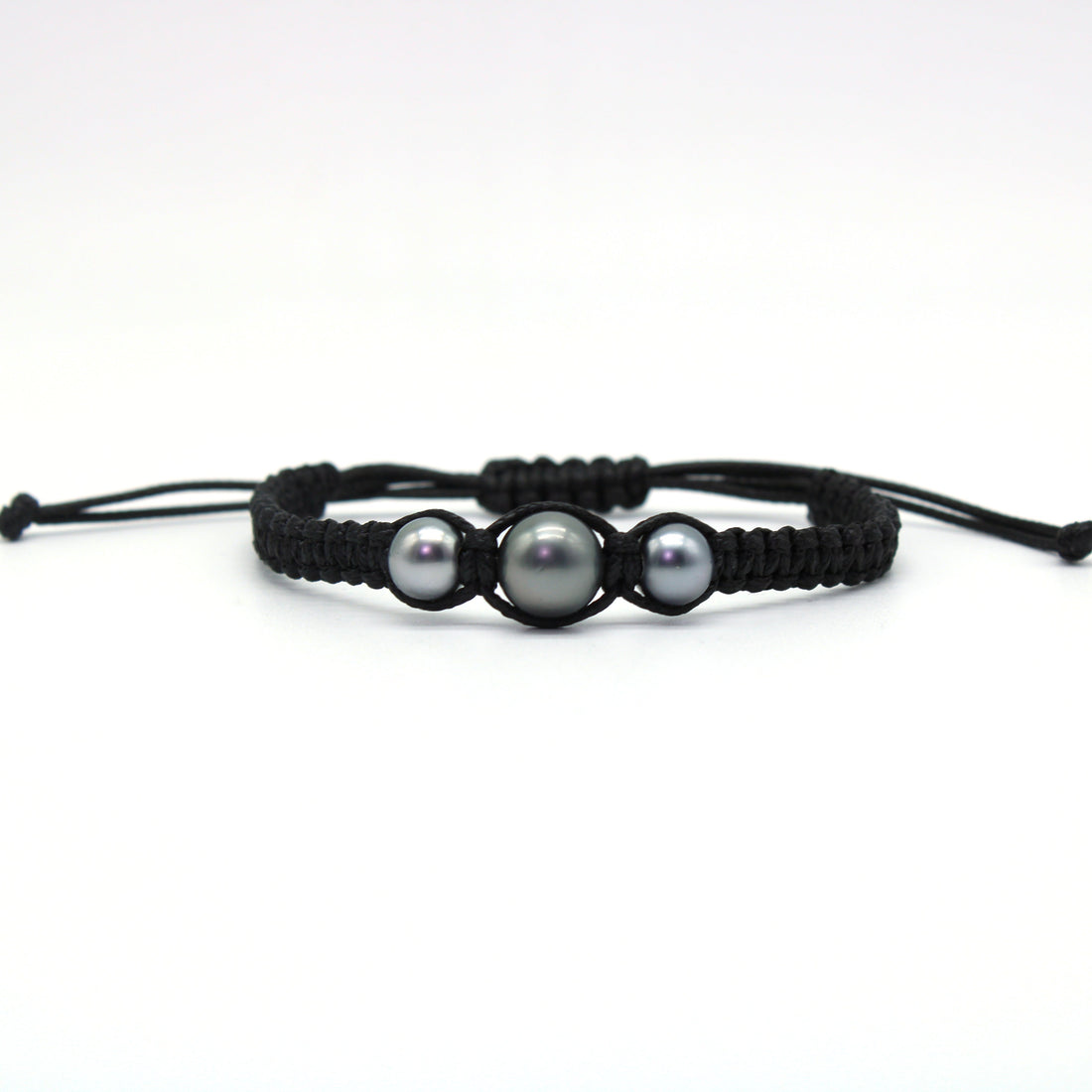 A hand braided macrame style bracelet featuring a trio of sustainably sourced pearls from Anuna Pearl farm.