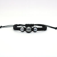 A hand braided macrame style bracelet featuring a trio of sustainably sourced pearls from Anuna Pearl farm.