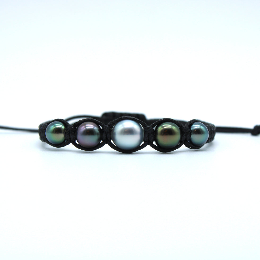 Pearl bracelet with five pearls on a white background