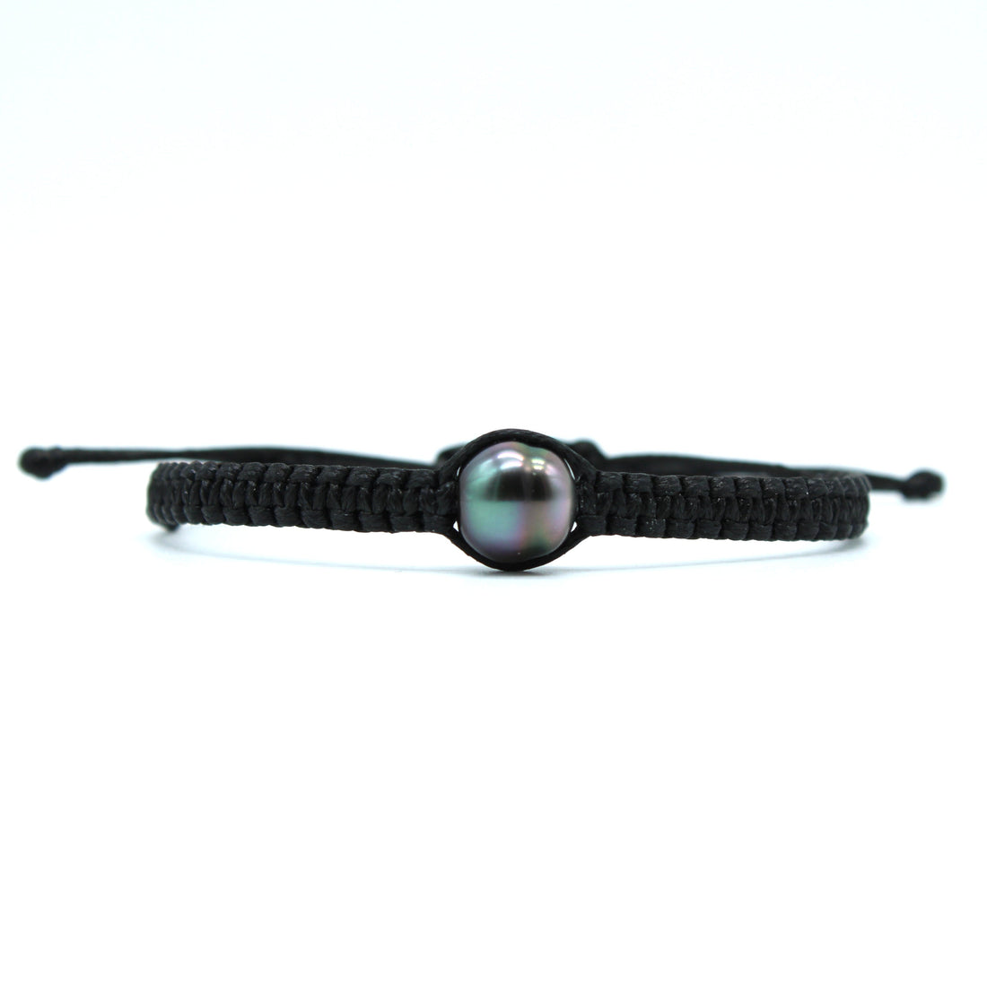 A black macrame bracelet featuring a central iridescent black pearl, set against a plain white background.