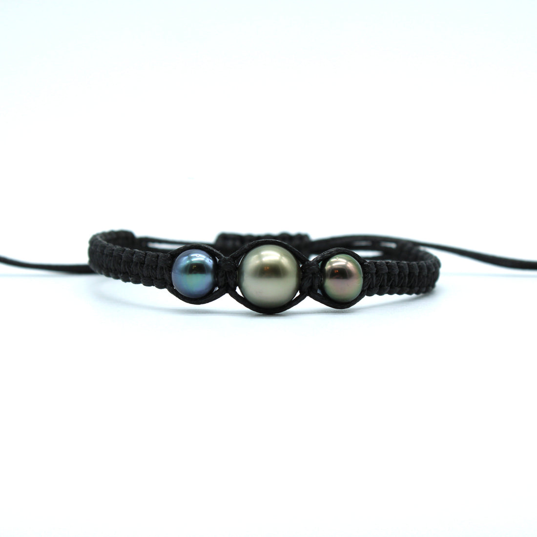 Black braided bracelet with three pearls on a white background