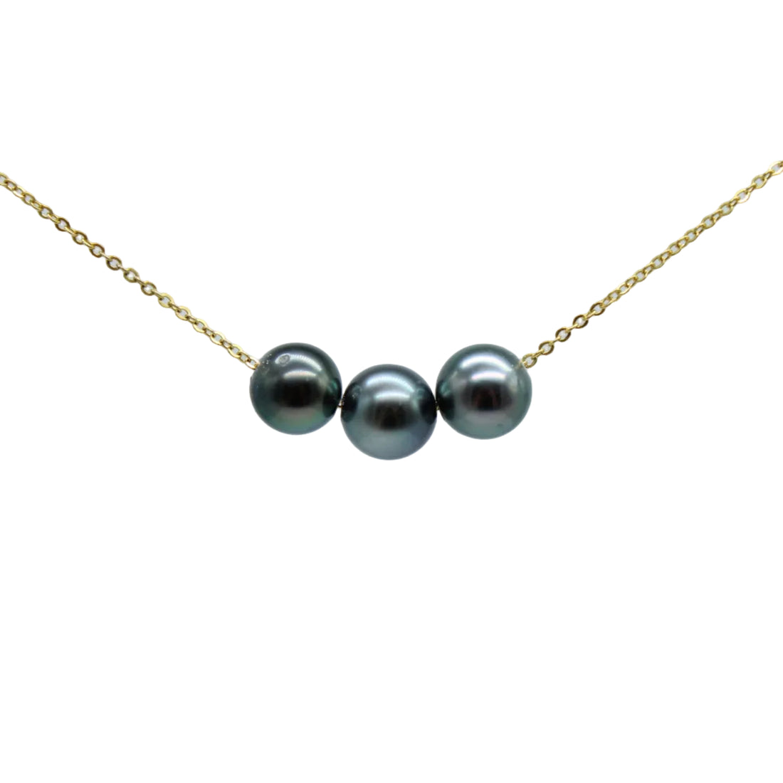 A delicate gold chain necklace featuring three colorful black pearls aligned horizontally in the center, set against a clean light gray background.