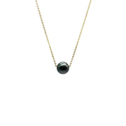 Necklace with a black pearl on a white background