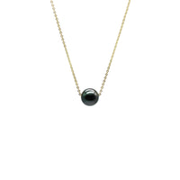 Necklace with a black pearl on a white background