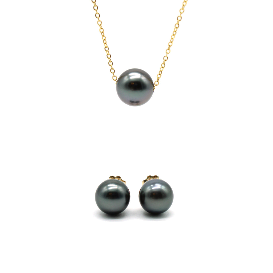 Black pearl necklace and stud earrings on a gold chain against a white background
