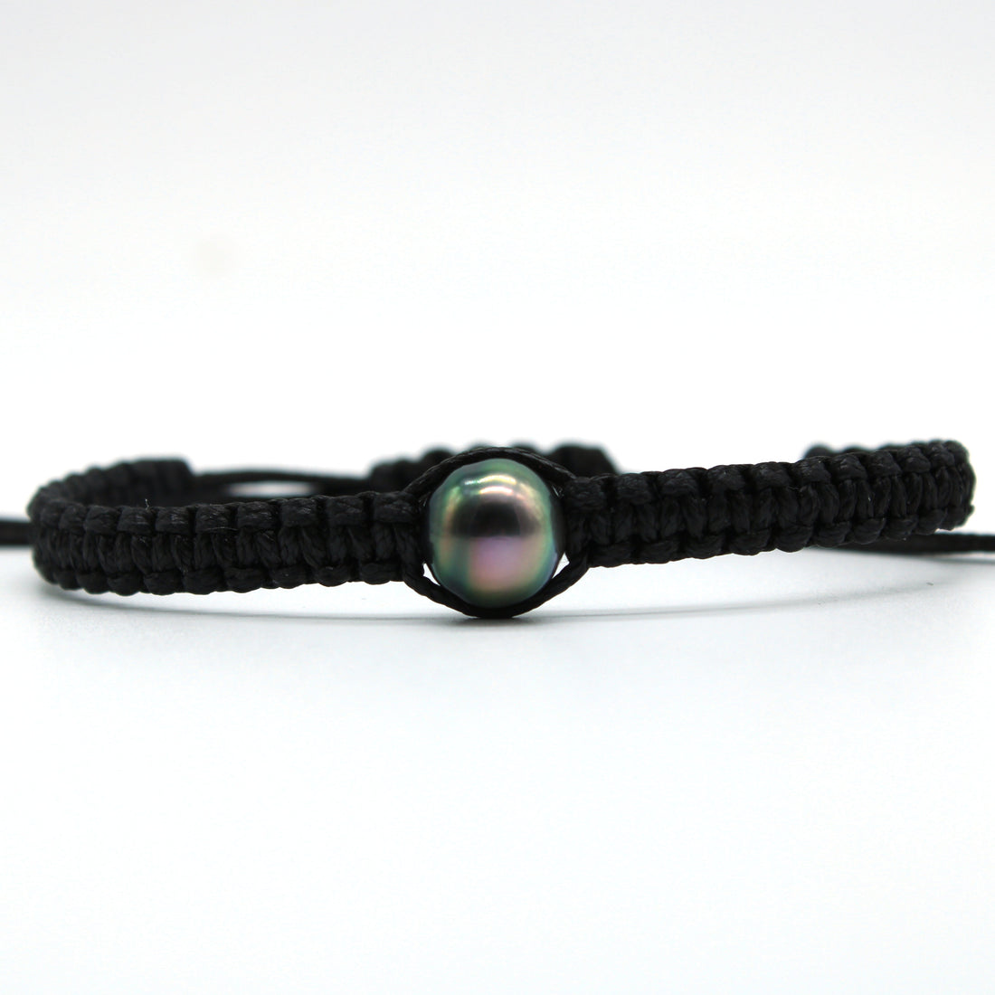 Black cord bracelet with a pearl on a white background