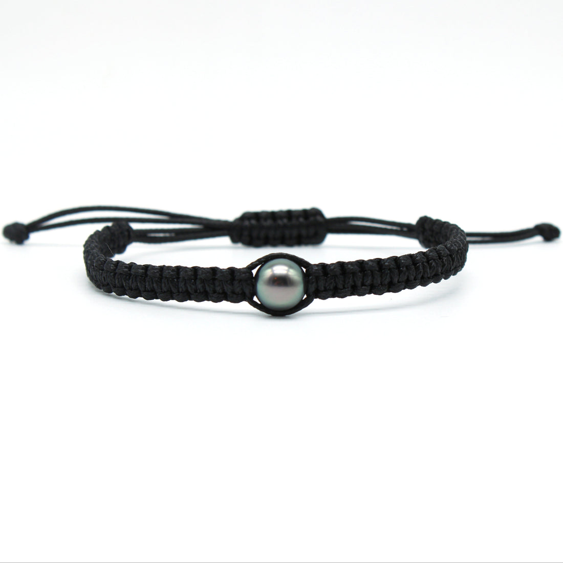 A hand braided macrame style tahitian black pearl bracelet on waxed polyester featuring a lustrous, 9mm, blue/green, tahitian pearl.