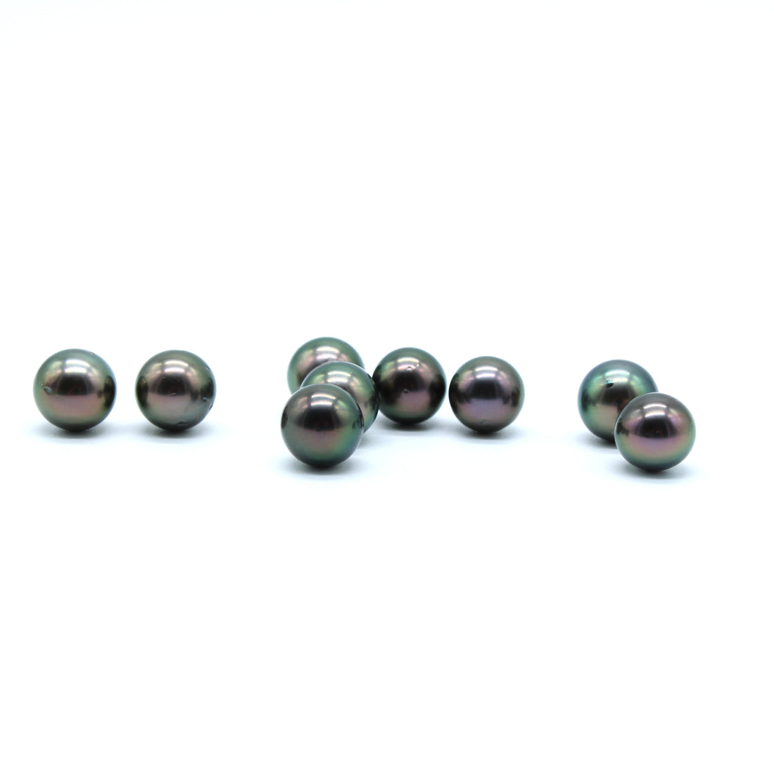 Peacock pearls on a white surface 