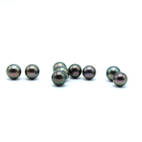 Peacock pearls on a white surface 