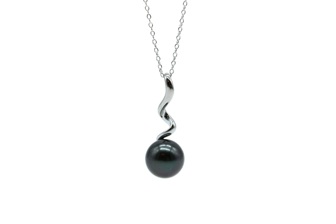 Black pearl necklace with a sterling silver swirl pendant on a white background