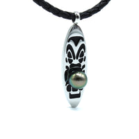 Necklace with a sterling silver surfboard medallion featuring a tahitian black pearl on a white background