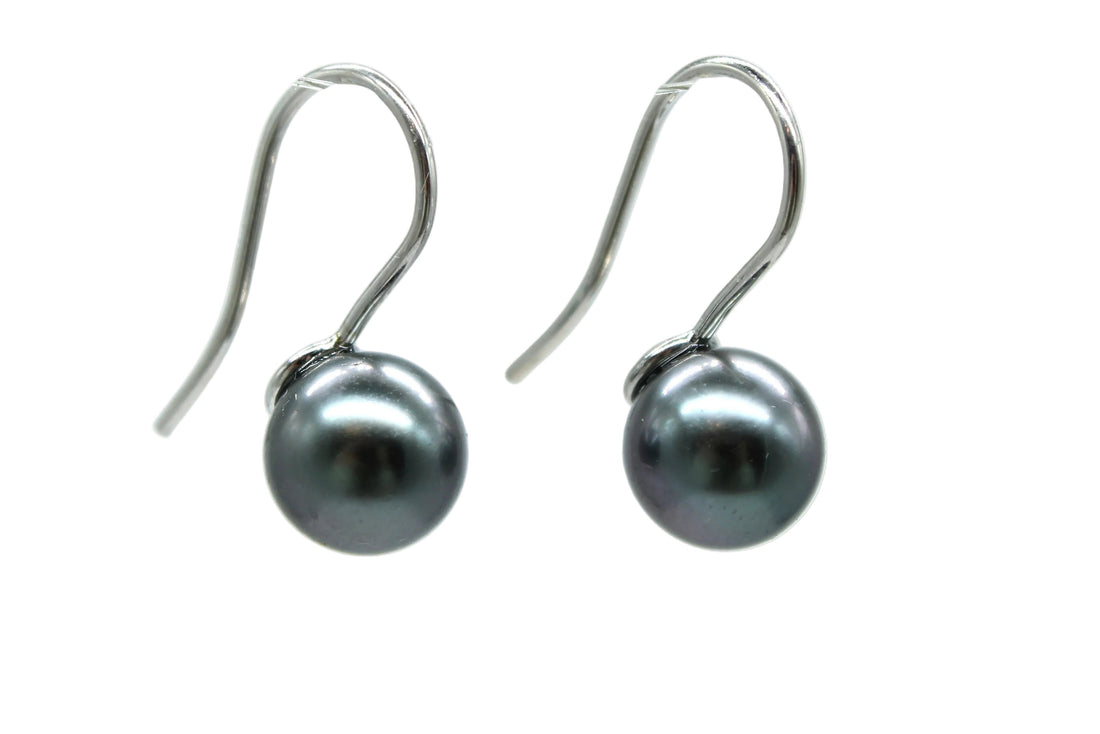 Pair of white gold french hook earrings side view with a white background