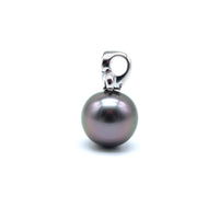 Side view of a white gold and lab grown diamond fleur de lis black pearl pendant on a white background