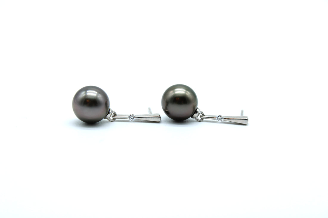 Pair of pearl earrings on a white background