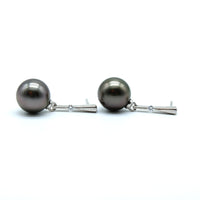 Pair of pearl earrings on a white background