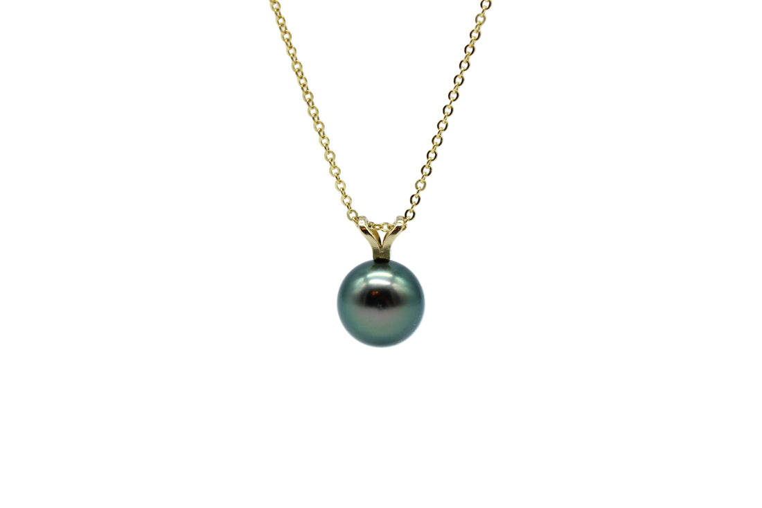 Yellow gold rabbit ear style pendant and necklace featuring a black pearl on a white background