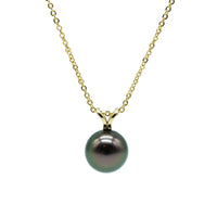 Yellow gold necklace and pendant featuring a black pearl on a white background